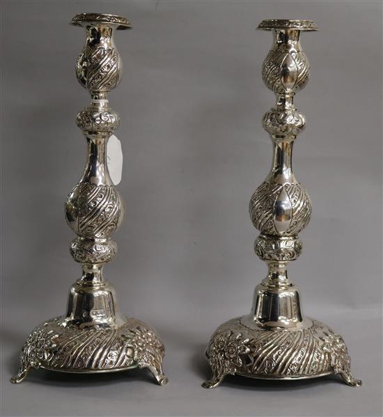 A pair of late Victorian silver Sabbath Day candlesticks, Moses Salkind, London, 1900, 35cm.